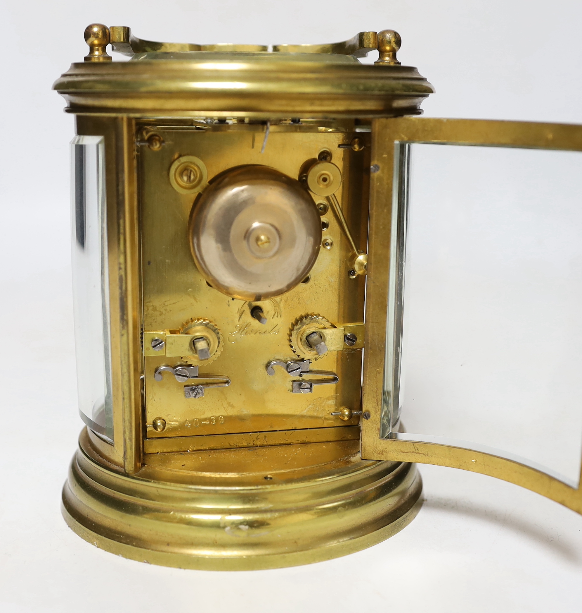 A late 19th century French oval brass cased eight day carriage clock